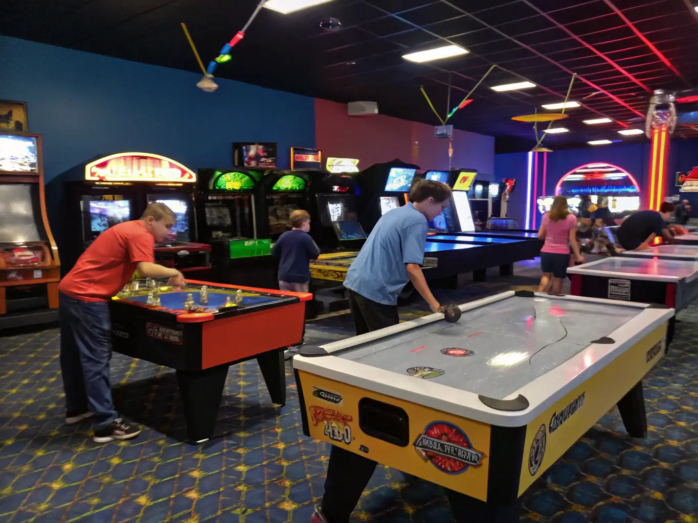 A group of youth playing table tennis and board games in a modern recreation room, with laughter and friendly competition, surrounded by colorful posters and comfortable seating.