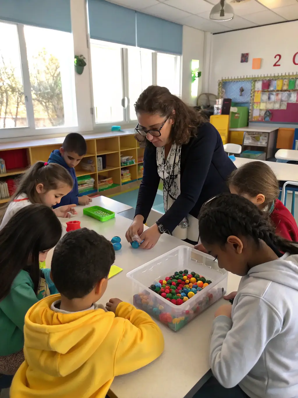 A candid image of a small group of children and a teacher gathered around a table, deeply engaged in a hands-on science experiment with beakers and glowing liquids.